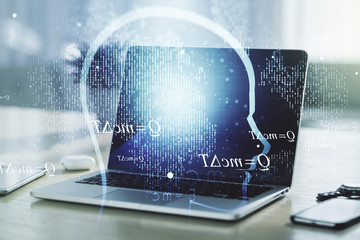 Creative artificial Intelligence concept with human head hologram on modern laptop background. Multiexposure