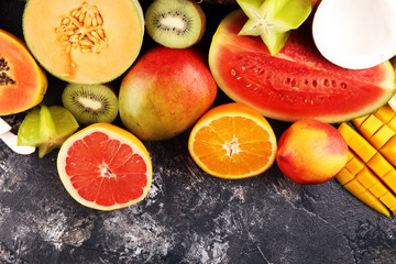 Tropical fruits background, many colorful ripe fresh tropical exotic fruits