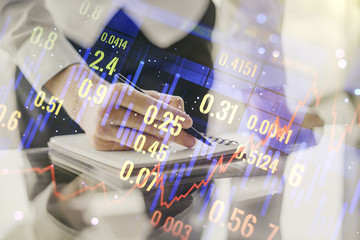 Multi exposure of abstract financial diagram with hand writing in notepad on background, banking and accounting concept