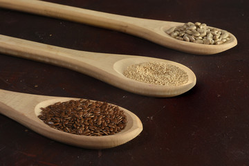 Three spoons with diferents cereals