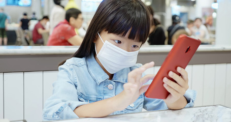 girl use smartphone with mask