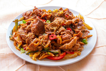 Stir fried with pork and vegetables sprinkle sesame seeds