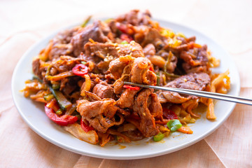 Stir fried with pork and vegetables sprinkle sesame seeds