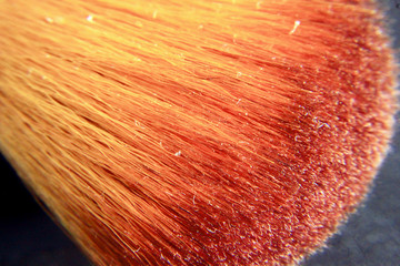 Macro photograph of a brown makeup brush, usually used as a color polish on the face