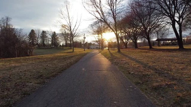 Stroll in the park at sunset during autumn Halloween season