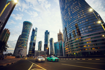 Futuristic modern skyscrapers in financial district at twilight in Doha, Qatar