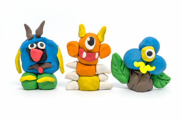 Play dough group monsters on white background. Handmade clay plasticine