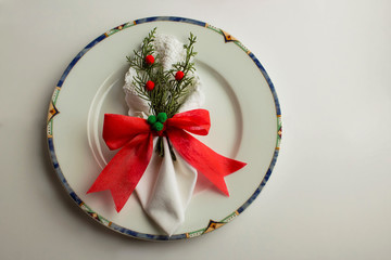 Designed with Christmas ornaments fabric napkins in white porcelain.Preparation is of Christmas or New year festival.