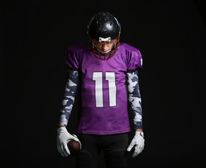 American football player on dark background