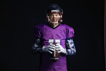 American football player on dark background