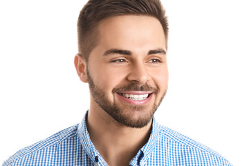 Handsome smiling young man on white background