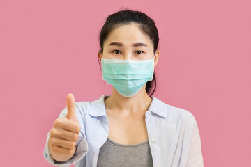 Young asian woman wore a gray undershirt, Blue shirt and protective masks against virus and air...