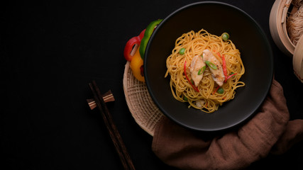 Overhead shot of Schezwan Noodles with vegetable, chicken and chilli sauce