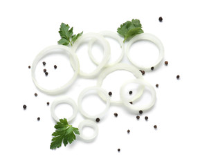 Obraz na płótnie Canvas Fresh raw onion rings, parsley and peppercorn on white background