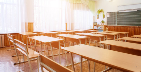 Interior of an empty school classroom. Concept of coronavirus COVID-19 quarantine in schools and educational institutions