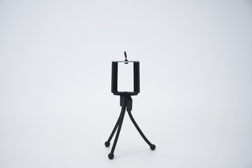Black mobile phone stand, octopus tripod in white background isolation
