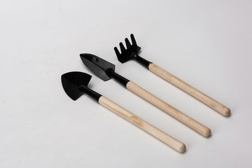Tools for cultivating flowers, shovel, shovel. Scarifier garden and other art tools in the white background
