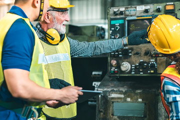 Industrial Engineers in Hard Hats.Work at the Heavy Industry Manufacturing Factory.industrial...