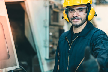 Industrial Engineers in Hard Hats.Work at the Heavy Industry Manufacturing Factory.industrial worker indoors in factory. man working in an industrial factory.