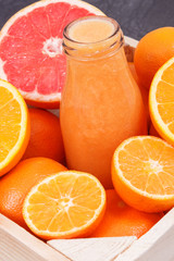 Freshly blended coctail or smoothie made of citrus. Healthy dessert for diet and slimming