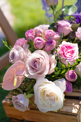 Bouquets of fresh flowers decoration of the festive table. Celebrating an open air party. Decor Details