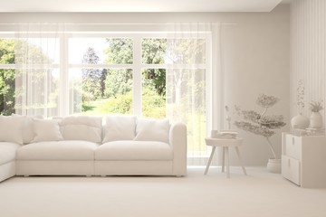 Mock up of stylish room in white color with sofa and green landscape in window. Scandinavian interior design. 3D illustration