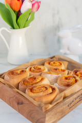 Fresh homemade easter cinnabon with carrots, cinnamon and cream sauce