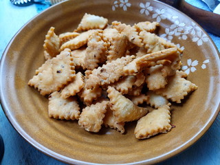 Namakpara (Khurma, Nimki, Mathri) which are  crispy, crunchy and savory strips in a bowl.