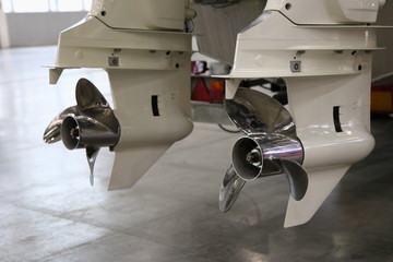 Two 200 hp white outboard motor lower units gear with right rotation boat propellers