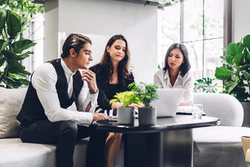 Group of professional business discussing meeting strategy sharing ideas thoughts with project.Creative business people working with laptop computer in green plant terrace decorated modern workloft