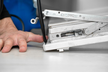 Professional master at repair and installation of windows, changes rubber seal gasket in pvc windows