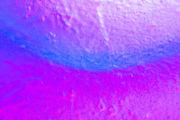 Beautiful bright colorful street art graffiti background. Abstract creative spray drawing fashion colors on the walls of the city. Urban Culture, black ,blue, purple , violet , neon texture