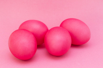 Easter eggs of pink color on a pink background. Happy easter.