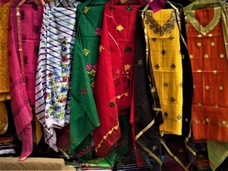 Multi colour multi style printed hanging indian dresses at surajkund craft fair, India