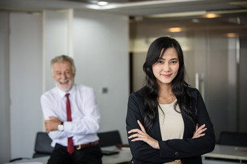 Asian business women and group using notebook for meeting and business women smiling happy for working