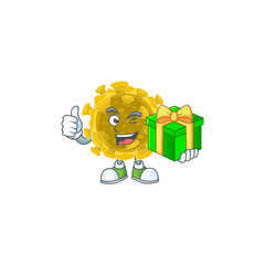 Cheerful infectious coronavirus cartoon character holding a gift box