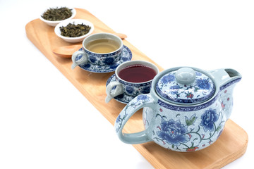 cup with tea and teapot on white  background. over light