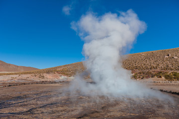 Boiling red mud pools in the geothermal area Sol de Manana in western Bolivia near Uyuni at an elevation of 15,900 feet resembling a landscape on planet mars.