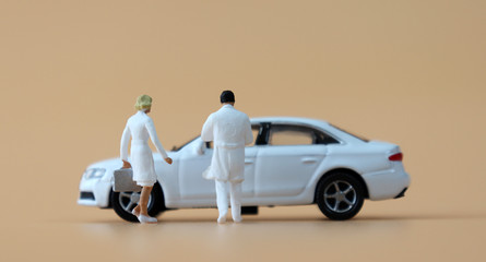 A miniature cars and miniature medical staff.