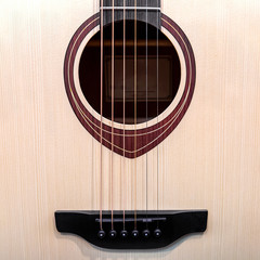 Obraz premium Six- string acoustic guitar close -up.