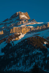 Beautiful early winter panorama of Oldenhorn mountain above Les Diablerets village in Switzerland on a sunny day.