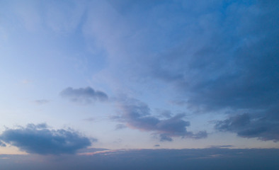 Naklejka na ściany i meble Evening blue sky with moderate clouds.