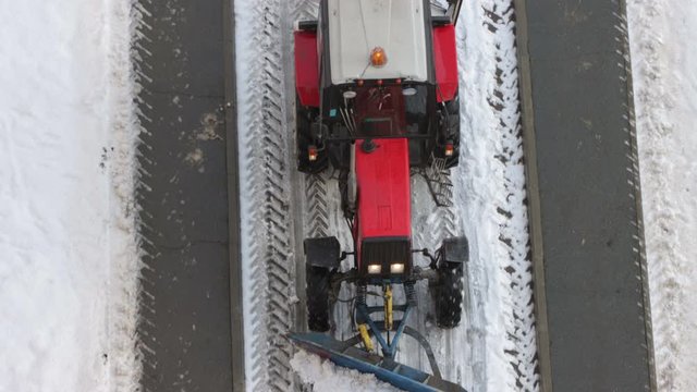Tractor removing snow from walkways