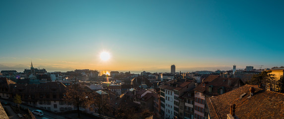 Panorama from Cathedral of Lausanne on the top of the hill in early evening hours. Panoramic evening view of Lausanne city from the Cathedral hill.