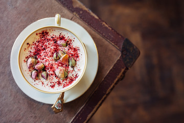 Hot chocolate served with flower decoration. New barista style. 