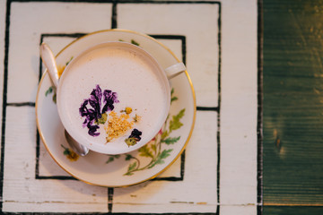 Hot chocolate served with flower decoration. New barista style. 