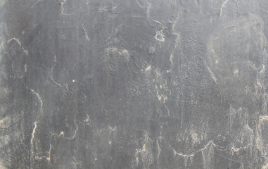 Light black, dirty painted matte background with old paint. Fine dust particles, stains.