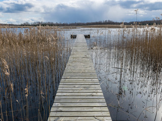 landscape with wooden footbridge in the center