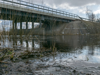 concrete bridge over the river, spring day