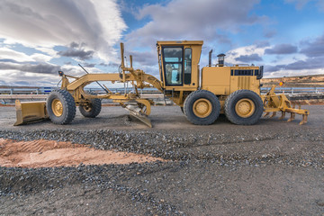 Excavator performing different tasks in the construction works of a highway
